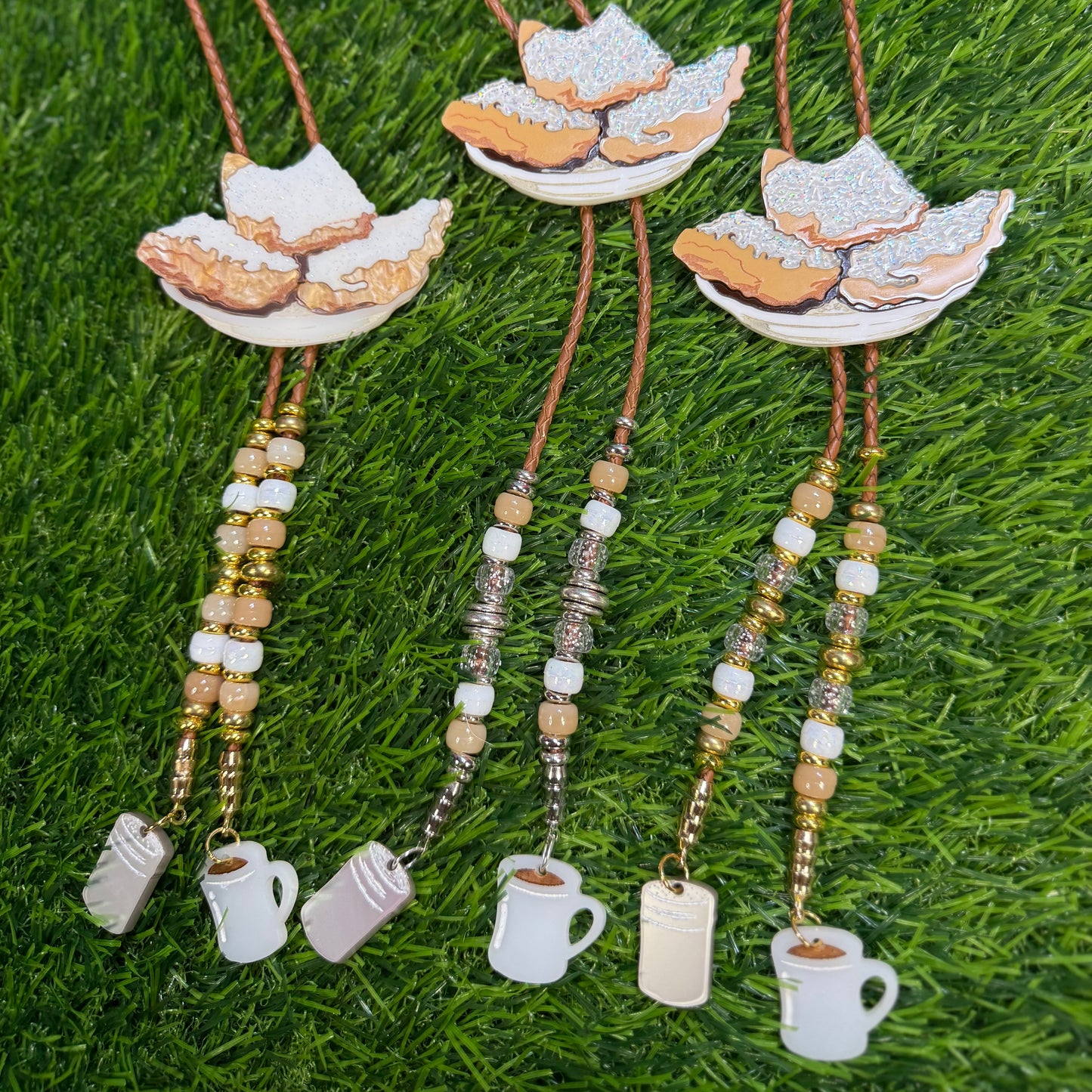 Order of Beignets Bolo Tie - Brown Beads with Charms